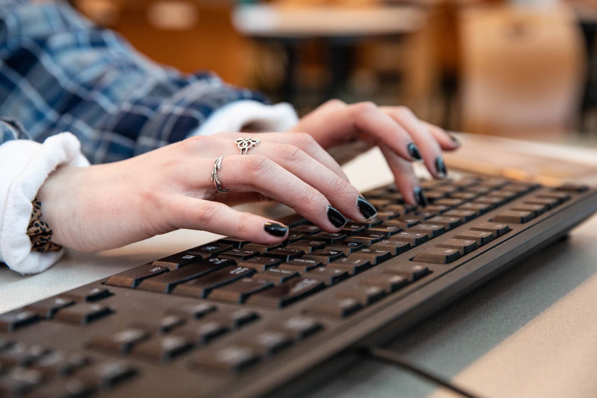Hands placed at a keyboard